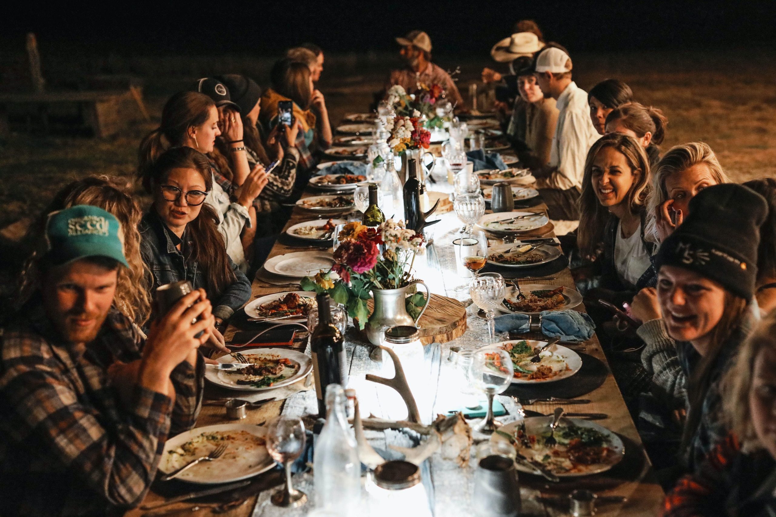 Long table dinner at Five Marys Farms Camp with Community Members